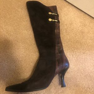 Brown suede heeled boots.
